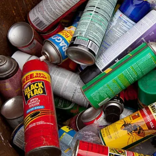 a pile of cans of insecticides