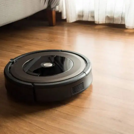 robot vacuum cleaner on a wooden floor