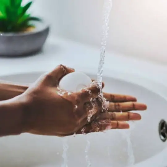 human washing hand with soap