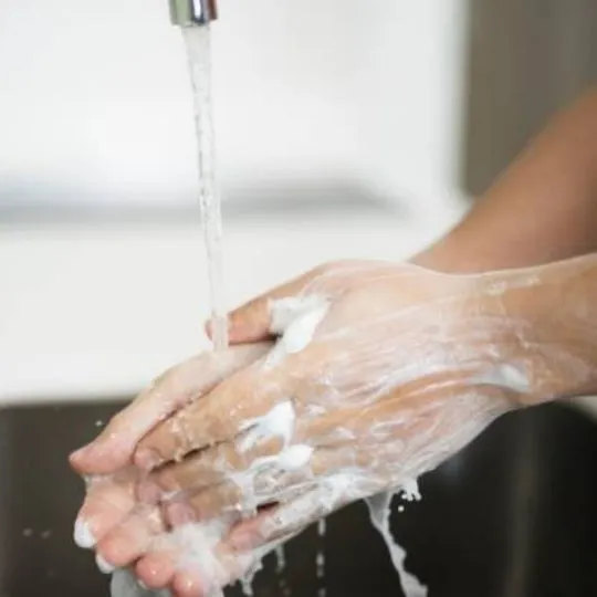 human washing hands with soap