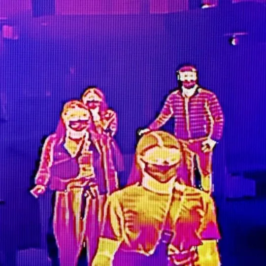 thermal image of four walking humans