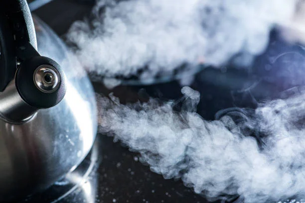 image of boiling kettle with steam coming out