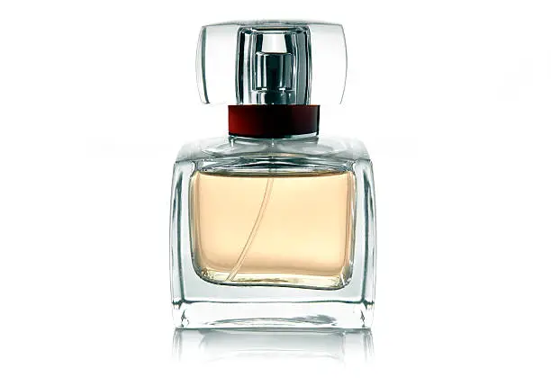 Perfume on white background with reflection